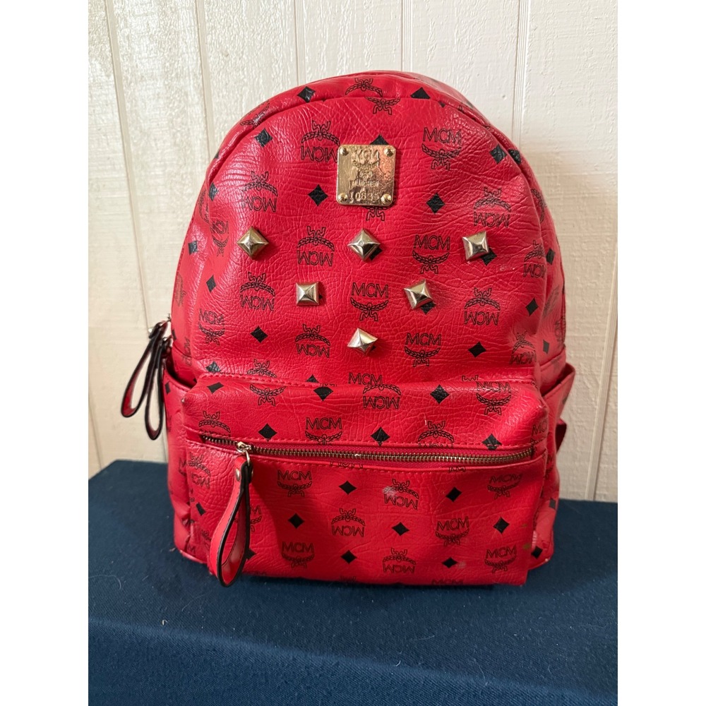 Red monogram-style studded backpack — pre-owned